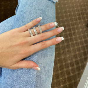 Female Model Wearing Platinum Emerald Cut Diamond Eternity Band Platinum, 17 Emerald-cut diamonds 8.85 carats D-G-VS+ 15GIA