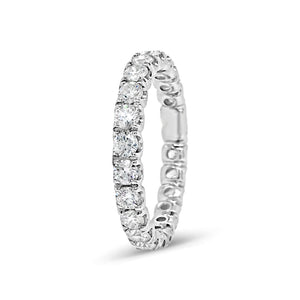 Simple Four Prong-Set Diamond Eternity Band -18k gold weighing 2.38 grams -24 round diamonds weighing 1.49 carats