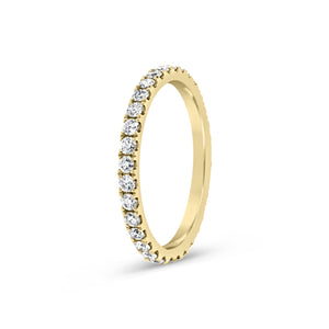Slim Four Prong-Set Diamond Eternity Band -18k gold weighing 1.60 grams -34 round four prong-set diamonds weighing .71 carats