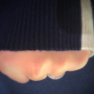 Female model wearing Four Prong-Set Diamond Eternity Wedding Band -18k white gold weighing 2.63 grams -84 round diamonds weighing 1.36 carats