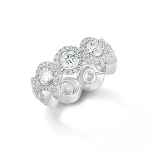 Halo Diamond Eternity Band -18k gold, 7.95 grams, 153 round shared prong-set brilliant diamonds 1.09 carats. - 9 round brilliant diamonds 4.12 carats.