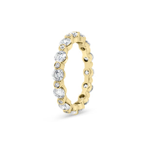 Single Prong Diamond Eternity Ring -18k gold weighing 2.72 grams -14 round bezel-set diamonds weighing 1.81 carats -14 round bezel-set diamonds weighing .14 carats
