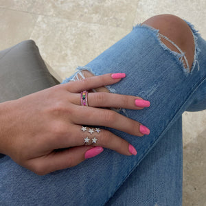 Female Model Wearing Gradient Diamond and Pink Sapphire Eternity Ring -14K gold weighing 1.42 grams -20 round diamonds totaling 0.26 carats -21 pink sapphires totaling 0.38 carats