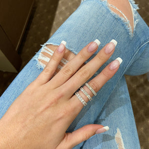 Female Model Wearing Diamond Eternity Band - 18K gold weighing 3.69 grams - 24 round diamonds totaling 1.73 carats