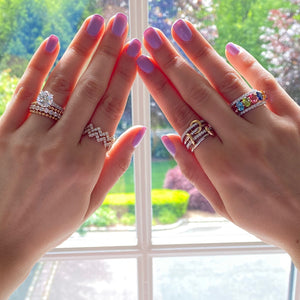 Female model wearing Multicolor gemstone eternity ring -14K gold weighing 3.52 grams -16 multicolor topaz gemstones weighing 7.47 carats