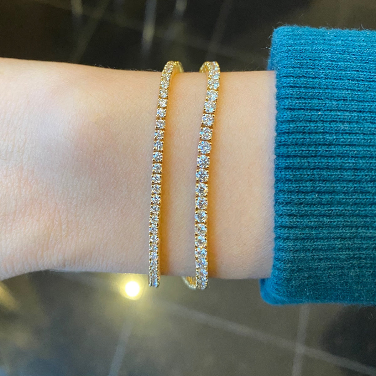 Female Model Wearing 2 ct Diamond Tennis Bracelet - 18K gold weighing 7.91 grams - 88 round diamonds weighing 2.0 carats