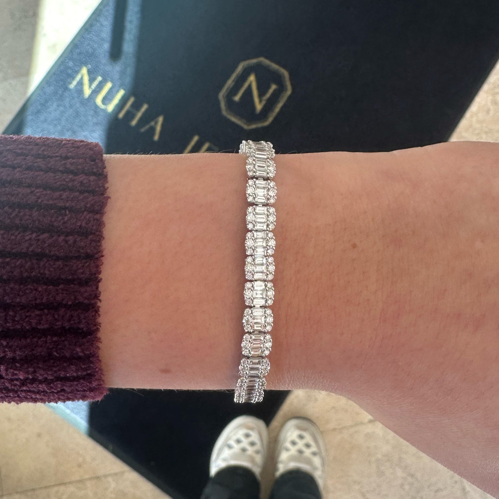 Round & Baguette Diamond Illusion Tennis Bracelet - 18K gold weighing 16.99 grams  - 225 round diamonds weighing 2.87 carats  - 112 straight baguettes weighing 4.08 carats