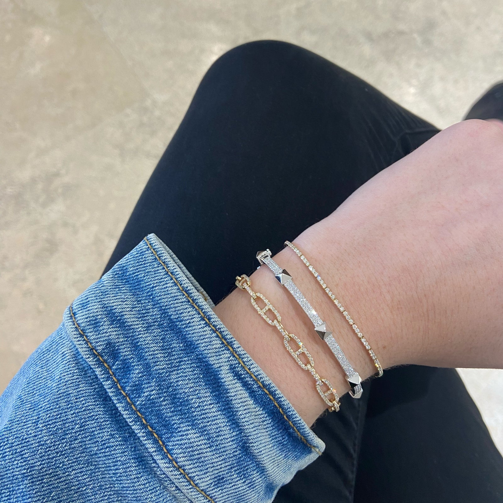 Diamond Pyramid Stud Bangle Bracelet  -14K gold weighing 10.79 grams  -315 round pave-set diamonds totaling 0.81 carats.