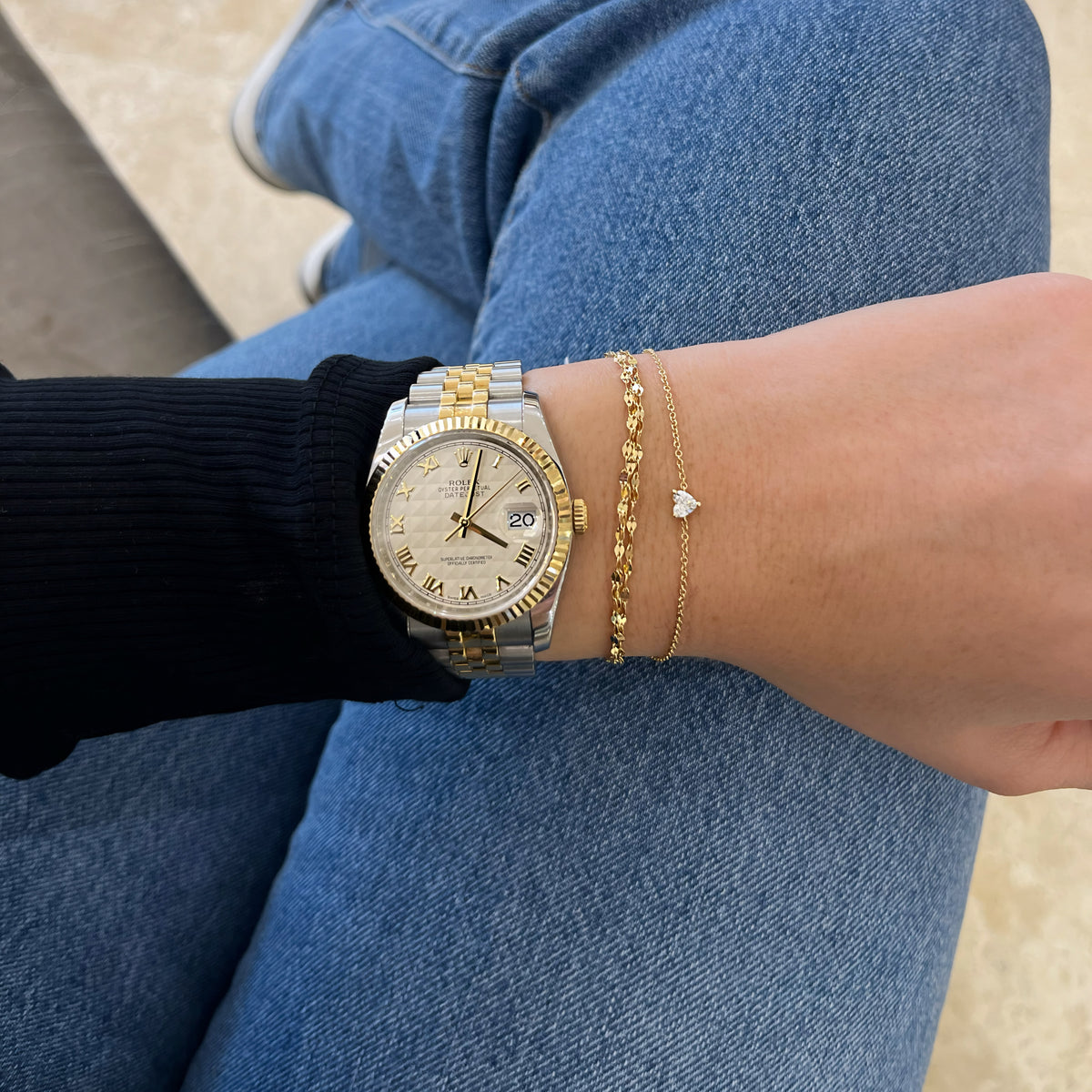 Female model wearing Gold triple dapped chain bracelet 
- 14K gold weighing 1.51 grams