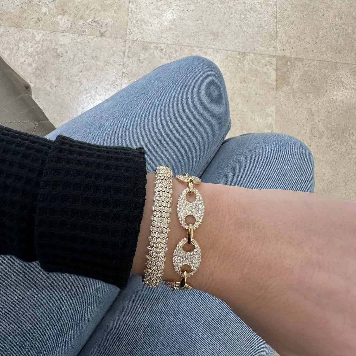 Female model wearing Diamond Multi Row Stretch Bracelet -18K weighting 35GR -10.51 total carat weight.