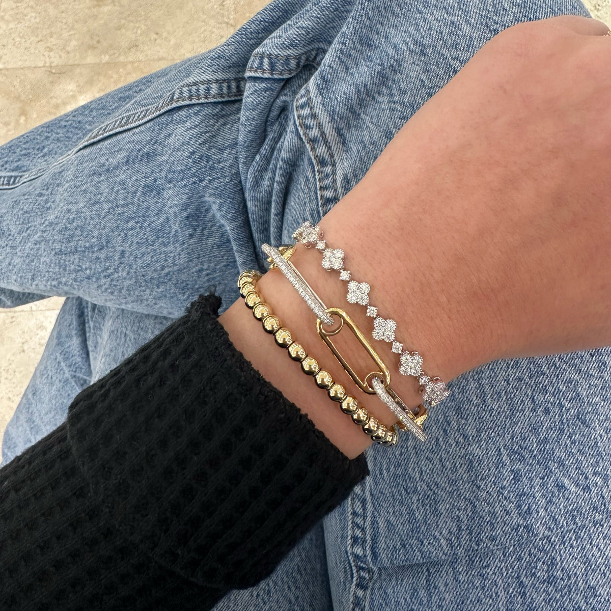 Female Model Wearing Two-Tone Gold & Paperclip Chain Bracelet - 18K gold weighing 27.01 grams - 679 round diamonds weighing 3.34 carats