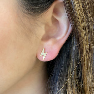 Female Model Wearing Diamond Lightning Bolt & Star Stud Earrings - 14K gold weighing 1.04 grams  - 35 round diamonds weighing 0.09 carats