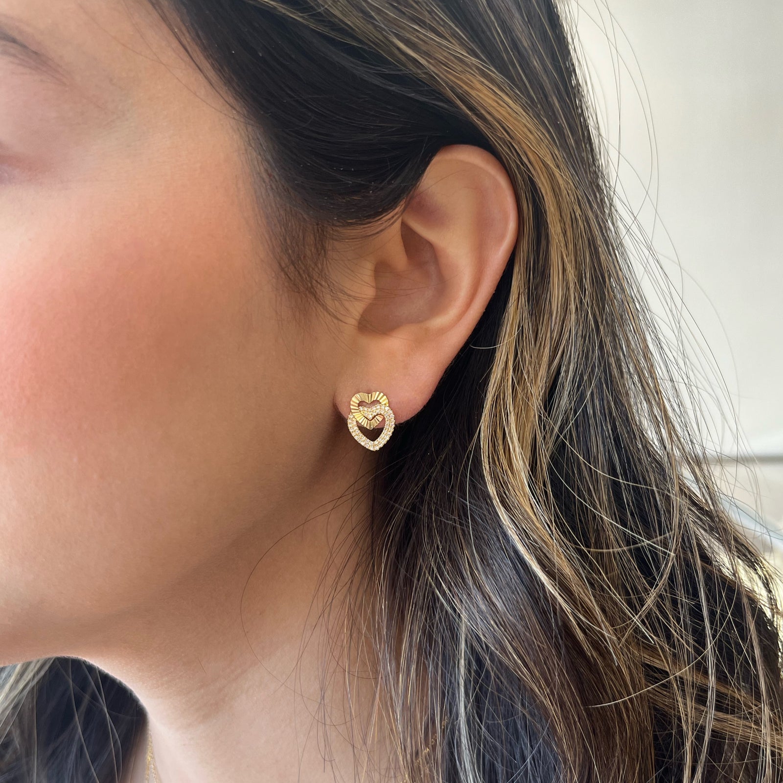 Diamond & Pleated Gold Interlocking Heart Stud Earrings - 14K gold weighing 2.56 grams  - 94 round diamonds weighing 0.23 carats