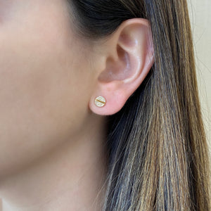 Female Model Wearing Diamond Plus & Minus Stud Earrings - 14K gold weighing 1.57 grams - 48 round diamonds weighing 0.12 carats