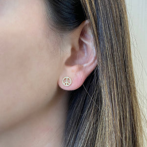Female Model Wearing Diamond Peace Sign Stud Earrings -14K gold weighing 1.50 grams -64 round diamonds weighing 0.17 carats