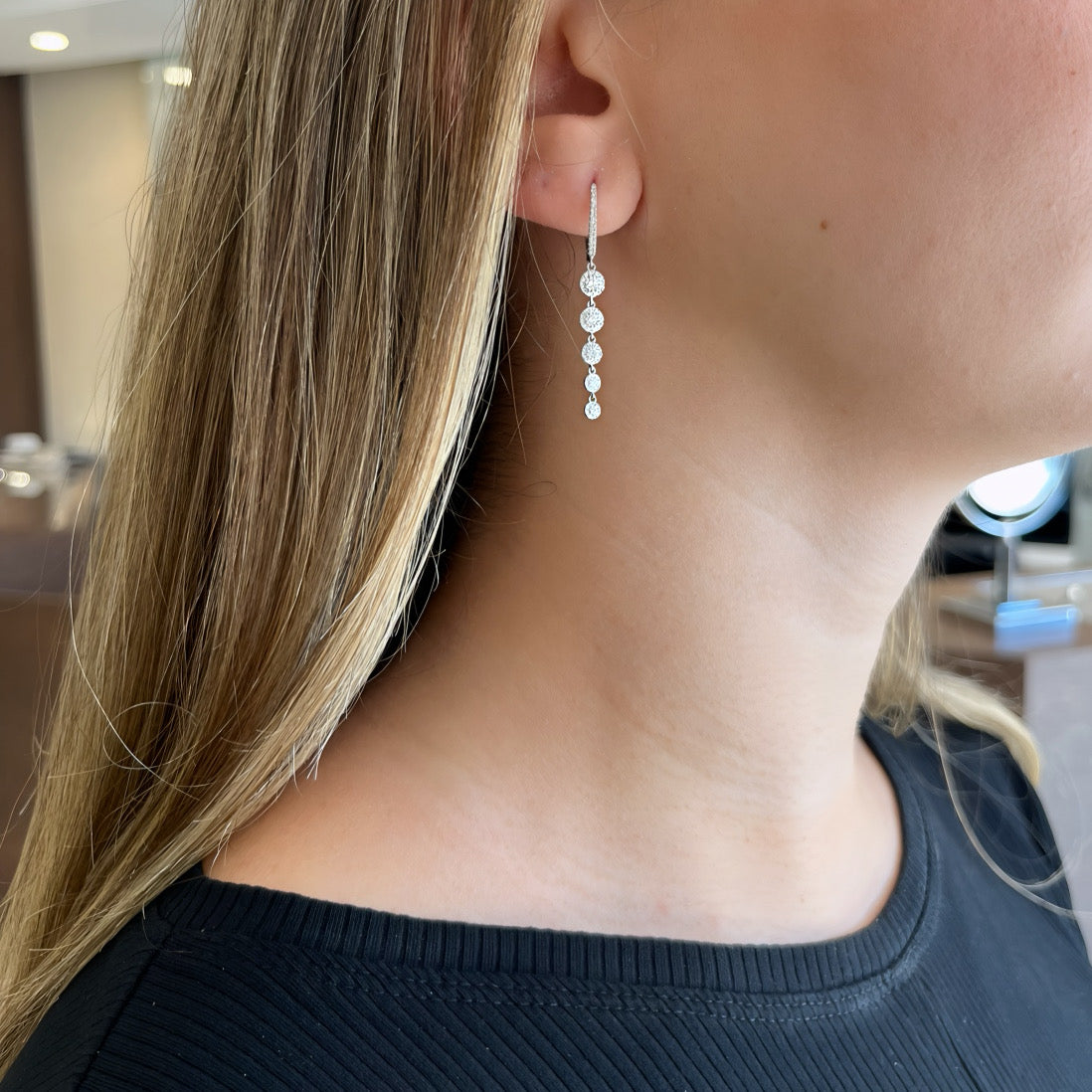 Halo diamond dangle huggie earrings - 14K gold weighing 2.36 grams
- 130 round diamonds weighing 0.58 carats