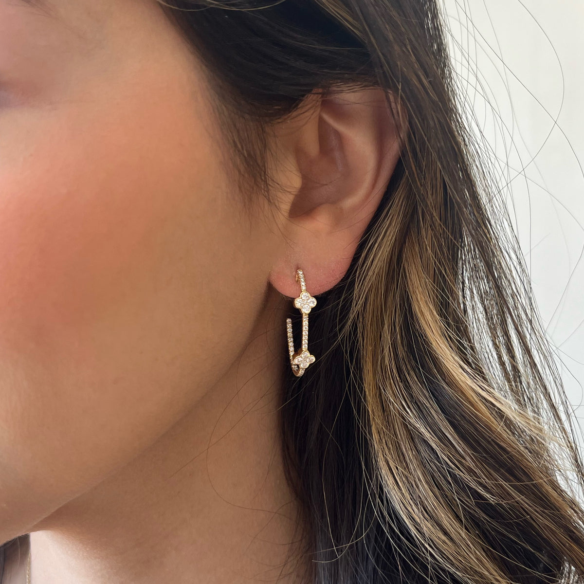 Female Model Wearing Diamond Clover Hoop Earrings - 14K gold weighing 3.57 grams - 78 round diamonds weighing 0.90 carats