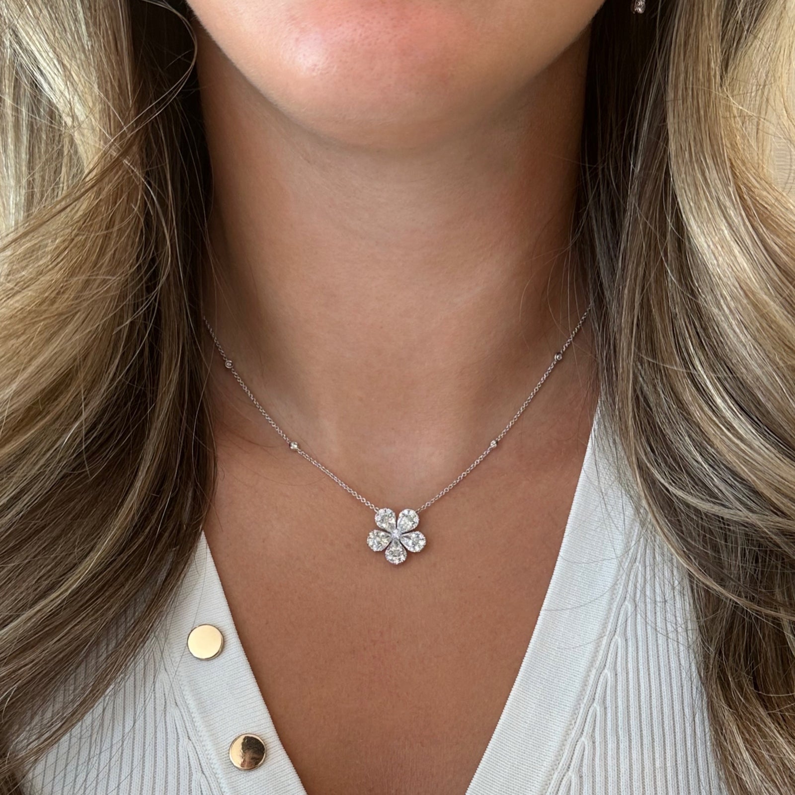 Round & Pear-Shaped Diamond Flower Pendant Necklace - 18K gold weighing 6.32 grams  - 5 pear-shaped diamonds weighing 1.49 carats  - 30 round diamonds weighing 0.54 carats