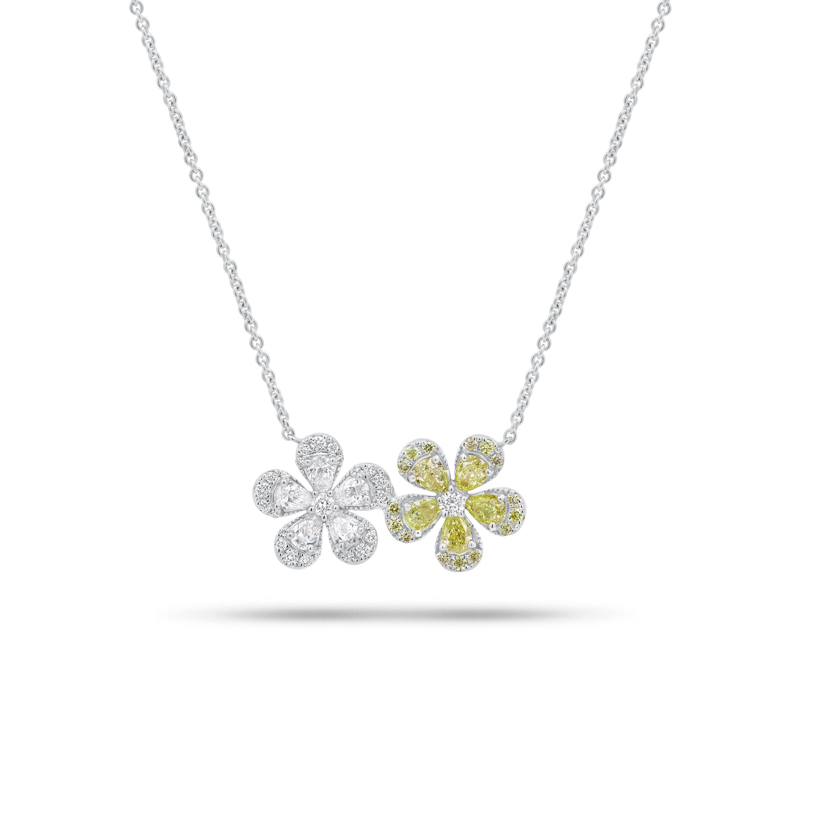 Yellow Diamond Double Daisy Pendant Necklace - 18K gold weighing 5.55 grams - 5 pear-shaped diamonds weighing 0.41 carats - 5 pear-shaped yellow diamonds weighing 0.59 carats - 31 round diamonds weighing 0.31 carats - 15 round yellow diamonds weighing 0.11 carats