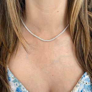 Female model wearing small diamond multi-row tennis necklace - 14K gold weighing 20.52 grams  - 453 round diamonds weighing 5.92 carats