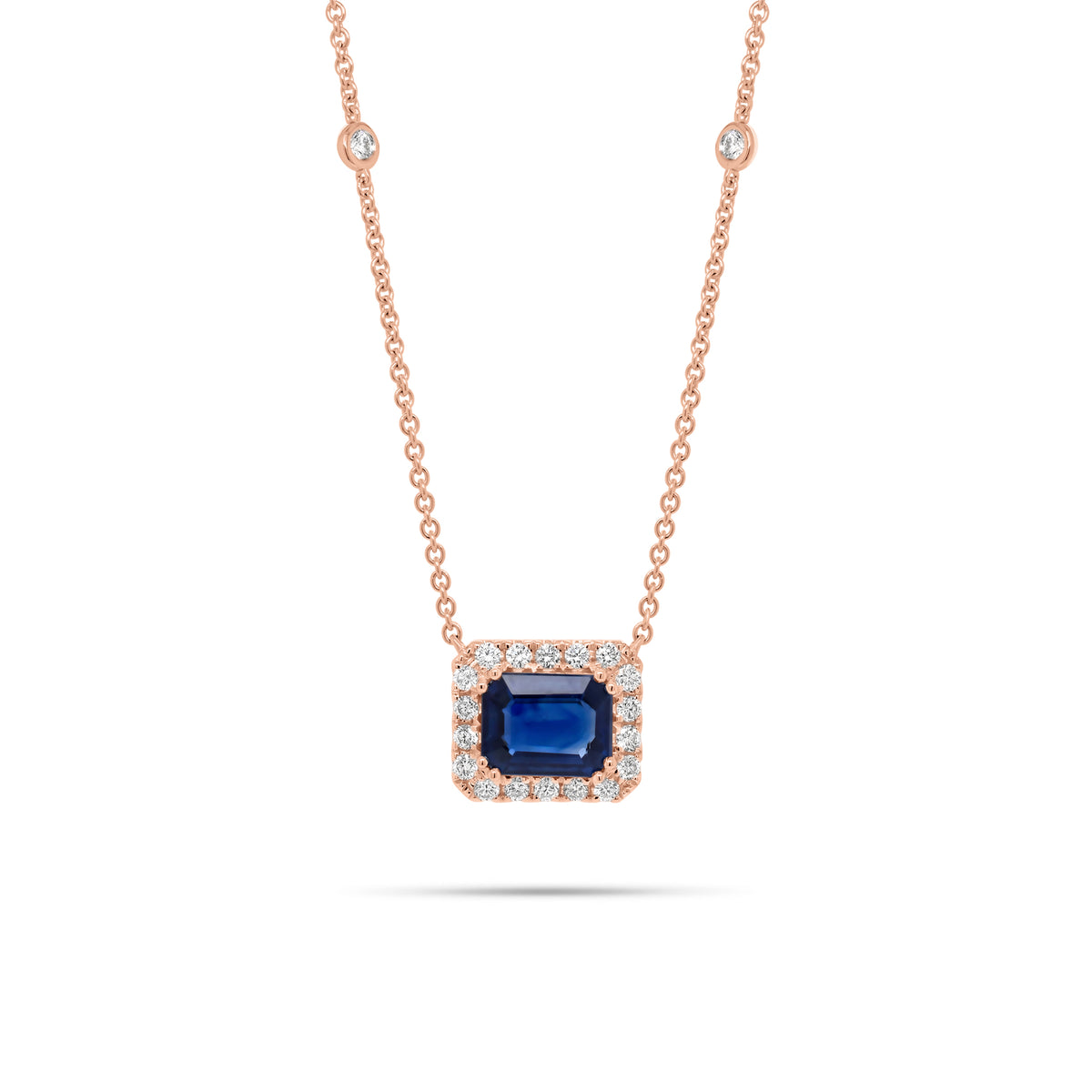 Emerald-Cut Sapphire Halo Diamond Pendant Necklace 18K gold weighing 4.79 grams 2.09 ct emerald-cut sapphire - 22 round diamonds weighing 0.44 carats