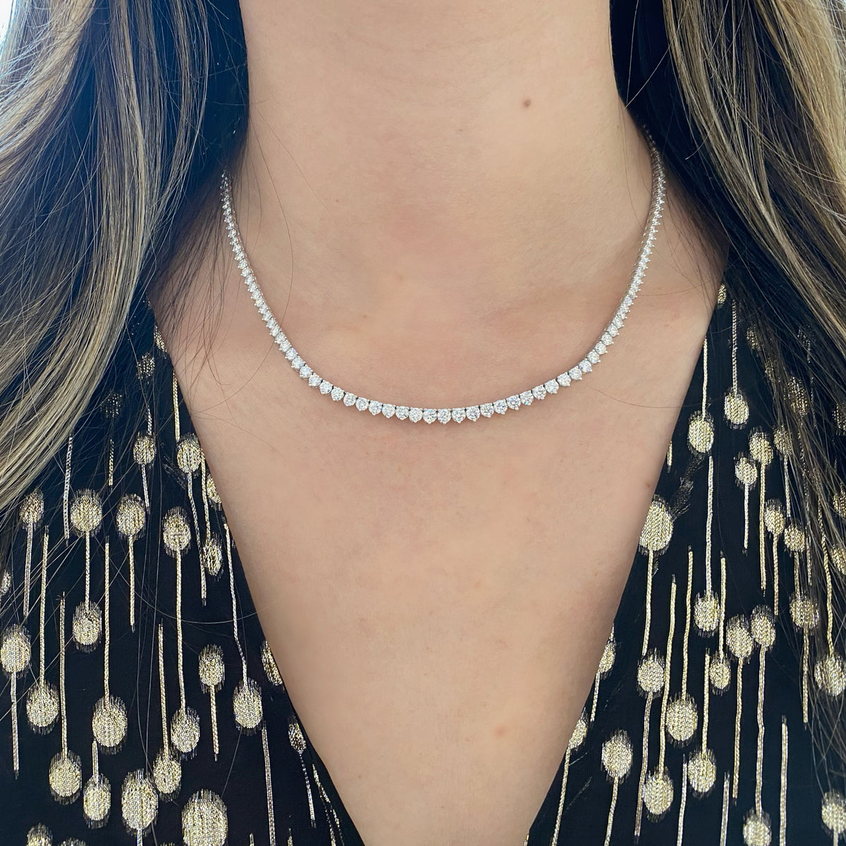 Female Model Wearing Diamond Tennis Necklace with Gold Beads - 18K gold weighing 18.17 grams - 11 round diamonds weighing 1.64 carats - 22 round diamonds weighing 2.40 carats - 48 round diamonds weighing 2.61 carats