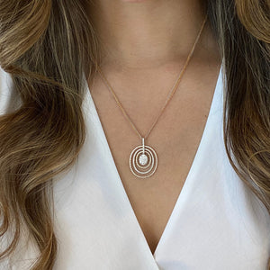 Female Model Wearing Diamond Concentric Ovals Pendant - 18K gold weighing 4.03 grams   - 14K gold weighing 4.20 grams  - 154 round diamonds weighing 1.23 carats
