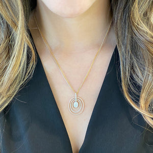 Female Model Wearing Diamond Concentric Ovals Pendant - 18K gold weighing 4.03 grams   - 14K gold weighing 4.20 grams  - 154 round diamonds weighing 1.23 carats