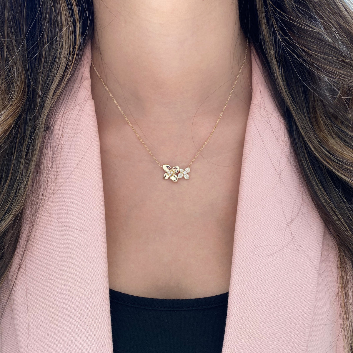 Female Model Wearing Diamond Flower Duo Pendant Necklace - 14K gold weighing 3.20 grams - 44 round diamonds weighing 0.18 carats