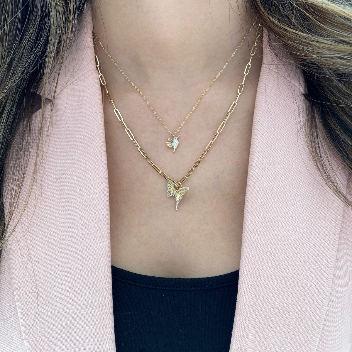 Female Model Wearing Diamond & Pleated Gold Butterfly Pendant - 14K gold weighing 1.15 grams - 74 round diamonds weighing 0.15 carats