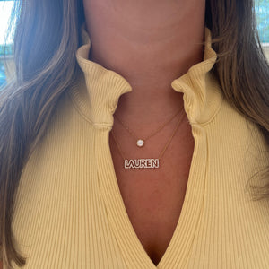 Female Model Wearing Diamond Block Letter Nameplate Necklace - 14K gold weighing 3.27 grams - 114 round diamonds weighing 0.54 carats