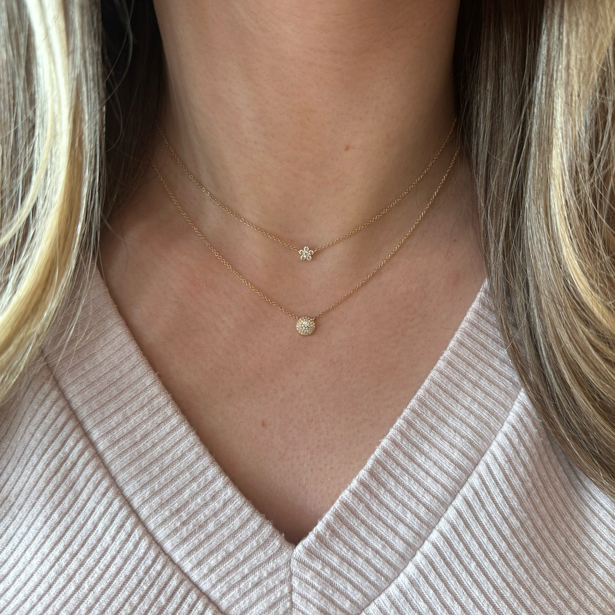 Female model wearing Diamond Simple Flower Pendant Necklace - 14K gold weighing 1.77 grams - 6 round diamonds weighing 0.18 carats