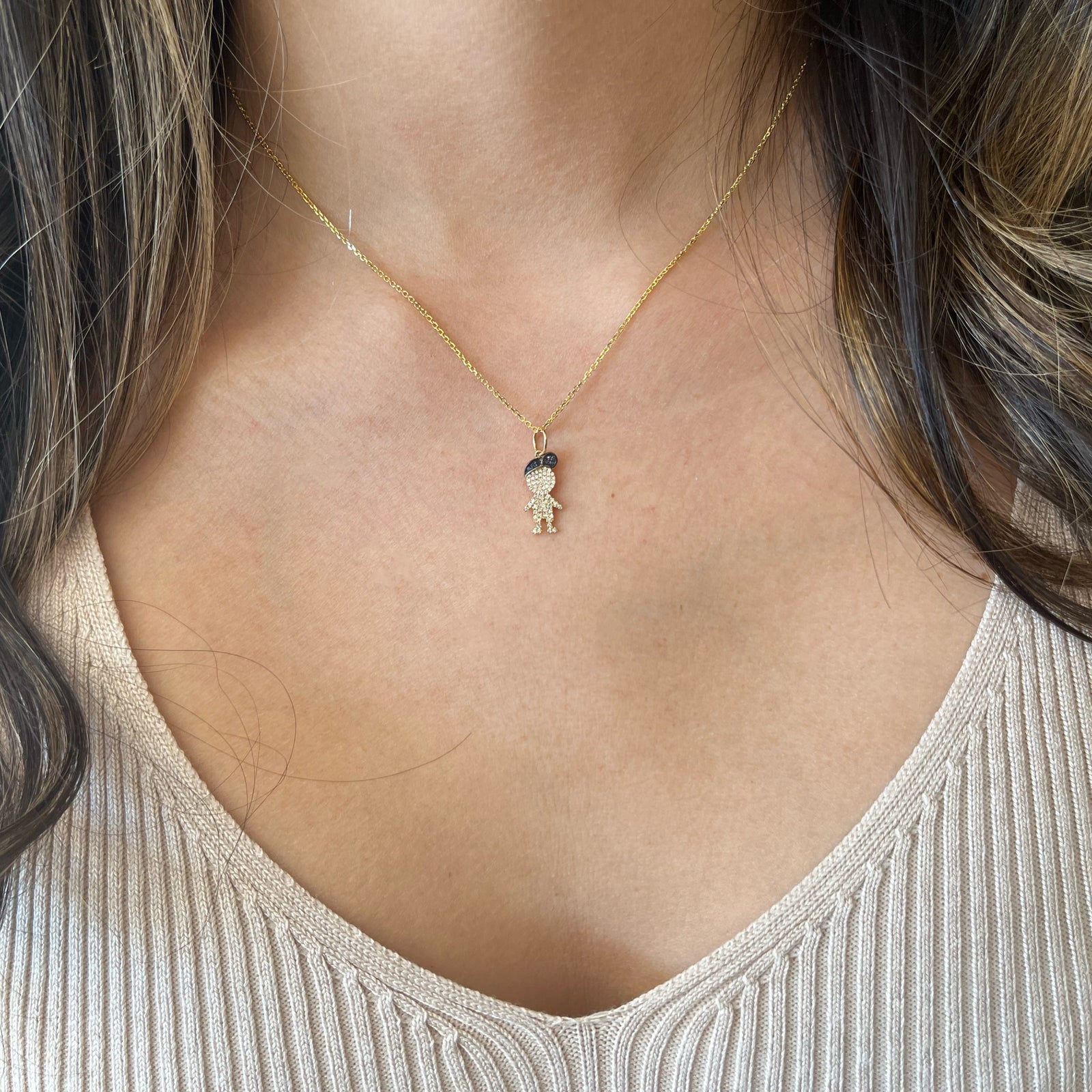 Diamond & Sapphire Boy Pendant - 14K gold weighing 2.50 grams  - 65 round diamonds weighing 0.13 carats  - 7 sapphires weighing 0.02 carats