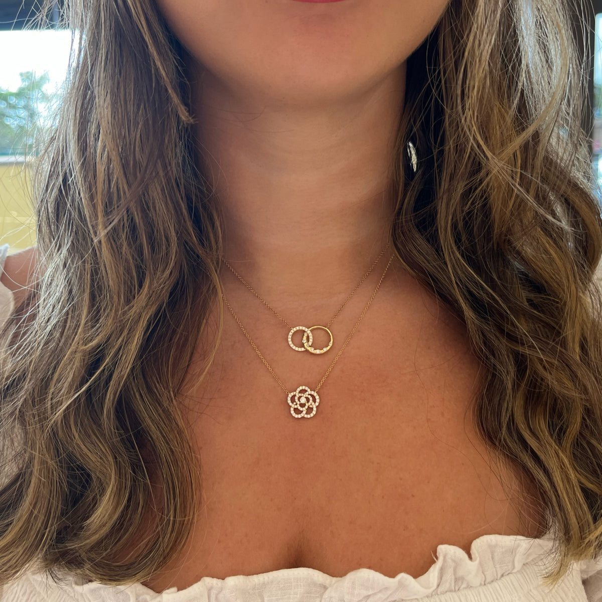 Female Model Wearing Diamond & Gold Interlocking Links Necklace - 14K gold weighing 3.40 grams - 26 round diamonds weighing 0.25 carats