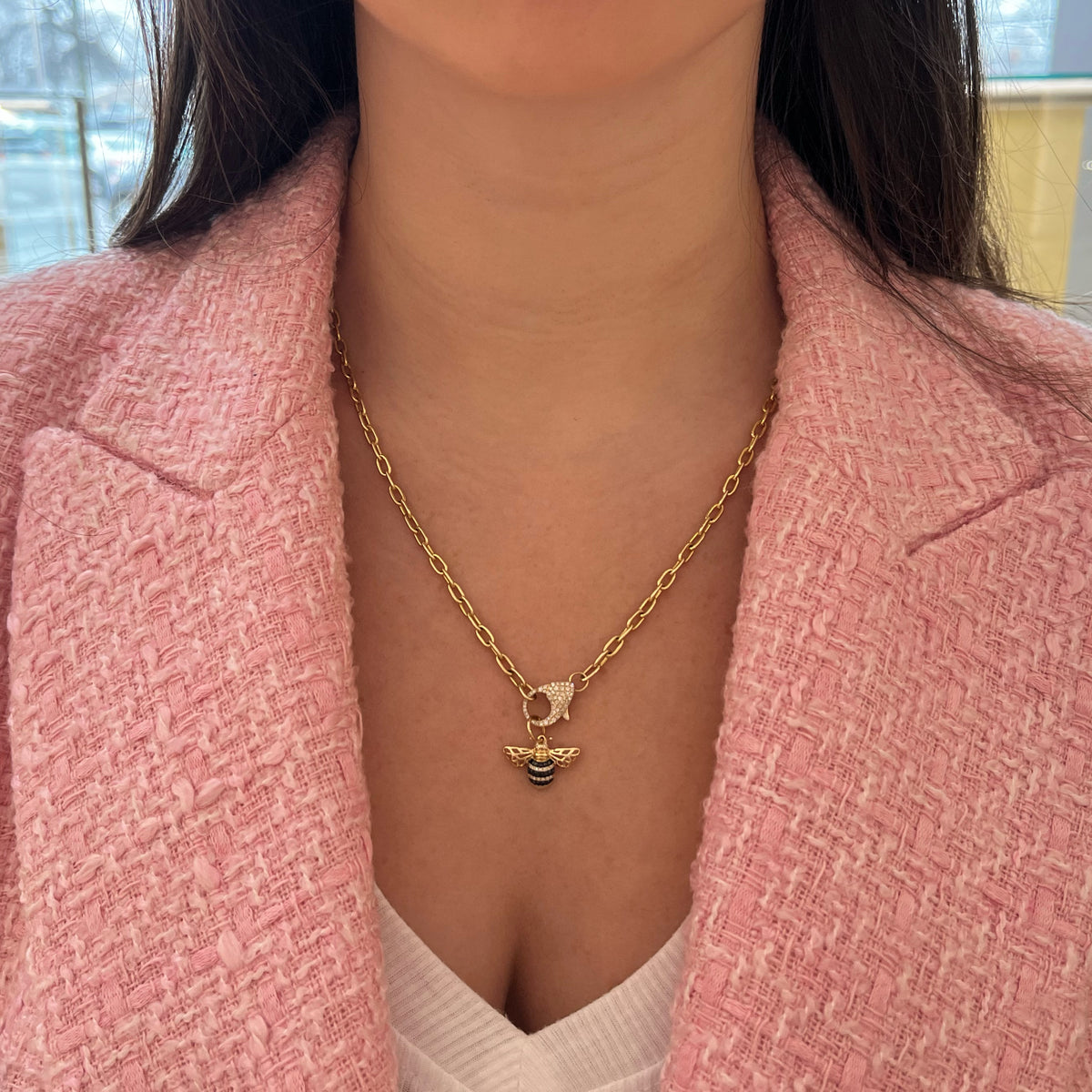 Female Model Wearing Black Diamond Bee Pendant - 14K gold weighing 1.34 grams - 24 round diamonds weighing 0.07 carats - 18 black diamonds weighing 0.11 carats