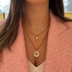 Female Model Wearing Diamond & Mother of Pearl Bee Circle Pendant - 14K gold weighing 3.70 grams - 85 round diamonds weighing 0.29 carats - Mother of Pearl slice weighing 7.56 carats