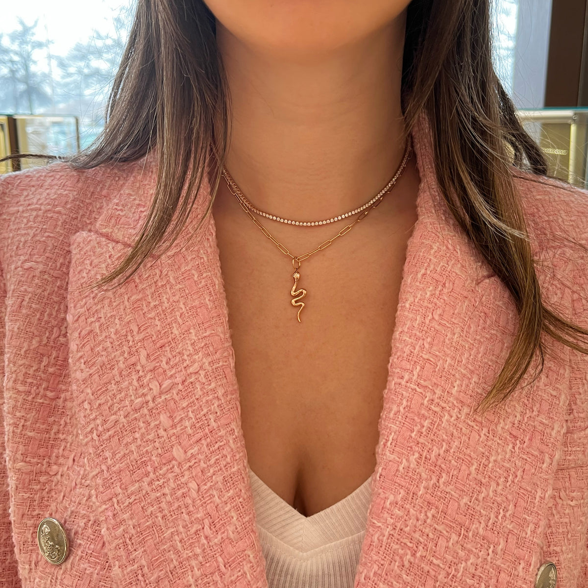 Female Model Wearing Diamond Snake Pendant - 14K gold weighing 1.84 grams - 2 round diamonds weighing 0.04 carats