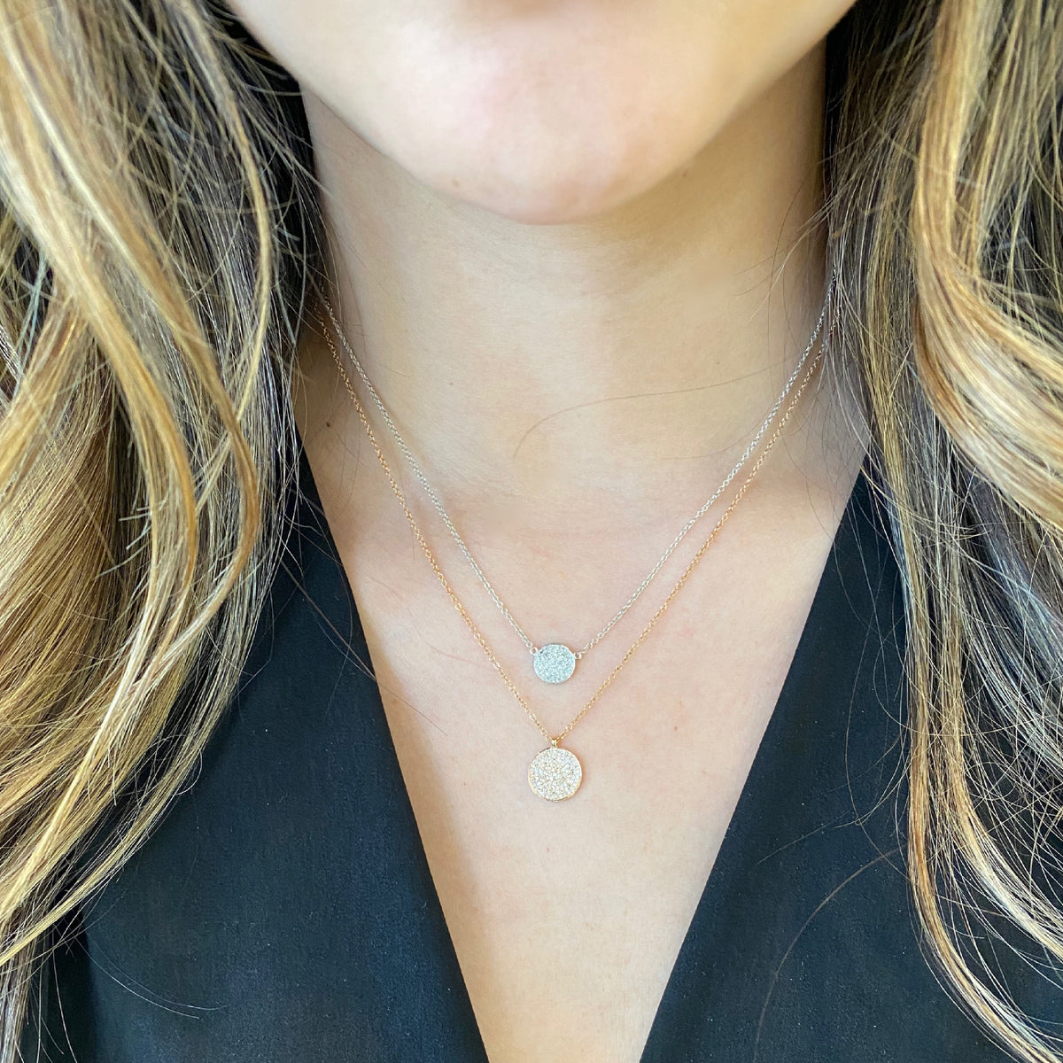 Female Model Wearing Diamond Disc Pendant - 14K gold weighing 2.22 grams - 94 round diamonds weighing 0.30 carats