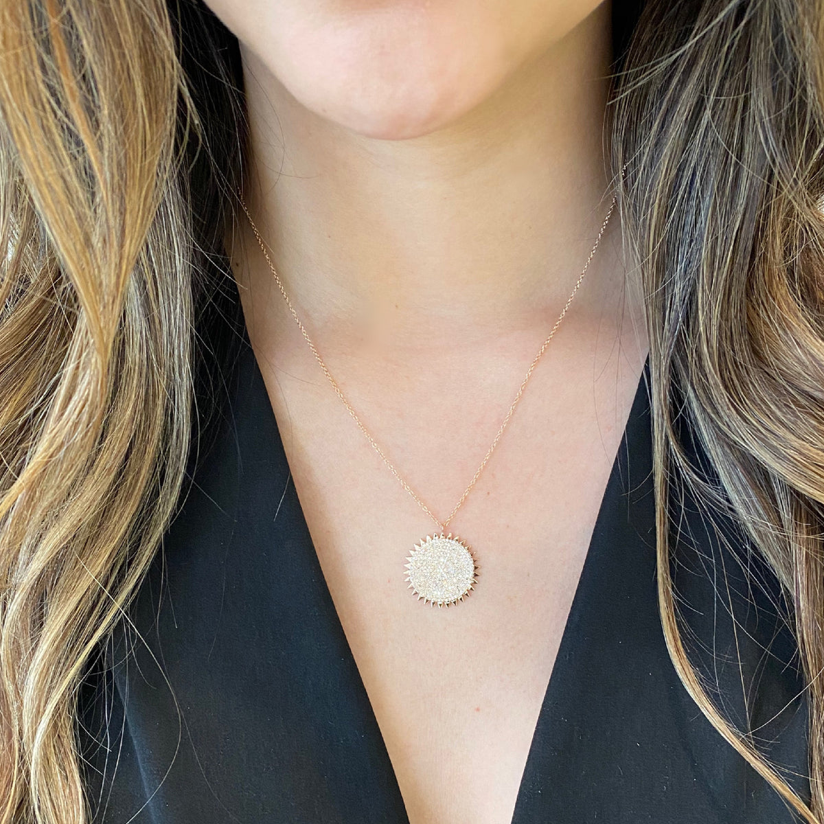 Female Model Wearing Diamond Sun Disc Pendant - 14K gold weighing 4.09 grams - 282 round diamonds weighing 0.64 carats