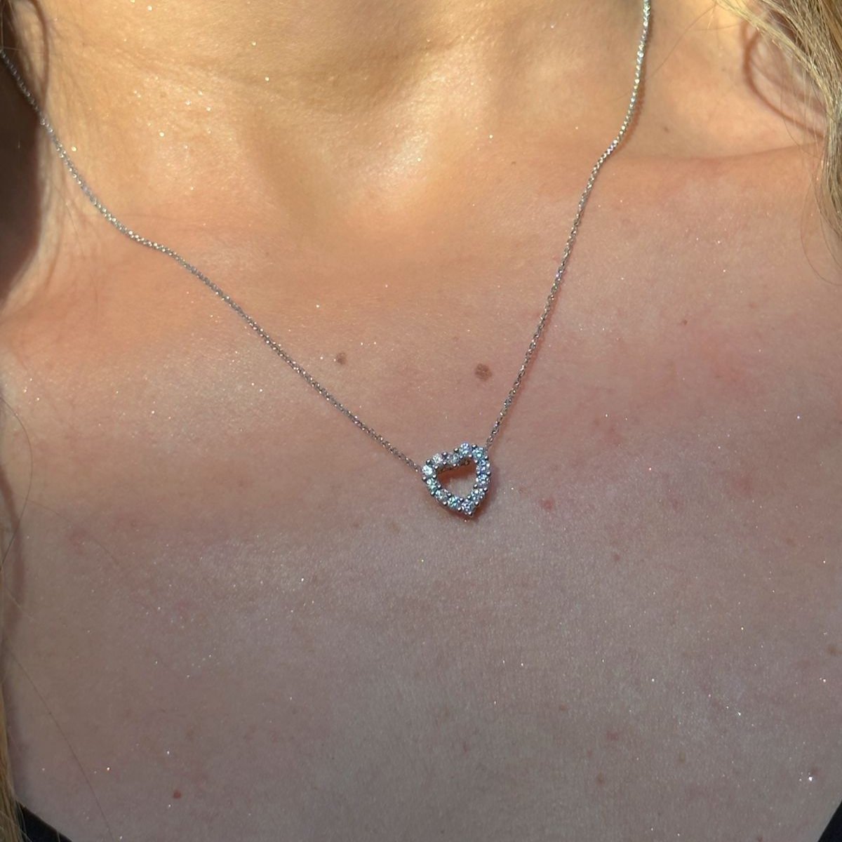 Diamond Open Heart Pendant Necklace  -14K gold weighing 2.72 grams  -14 round diamonds shared prong setting 0.53 carats