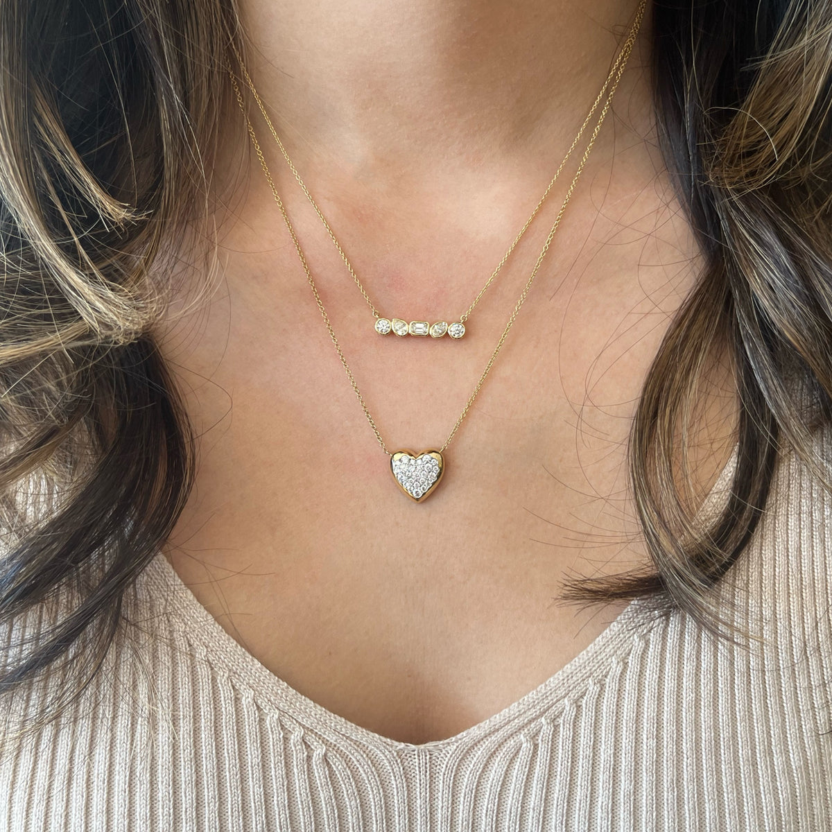 Female Model Wearing Diamond Puffed Heart Pendant Necklace - 14K gold weighing 3.72 grams - 25 round diamonds weighing 0.54 carats