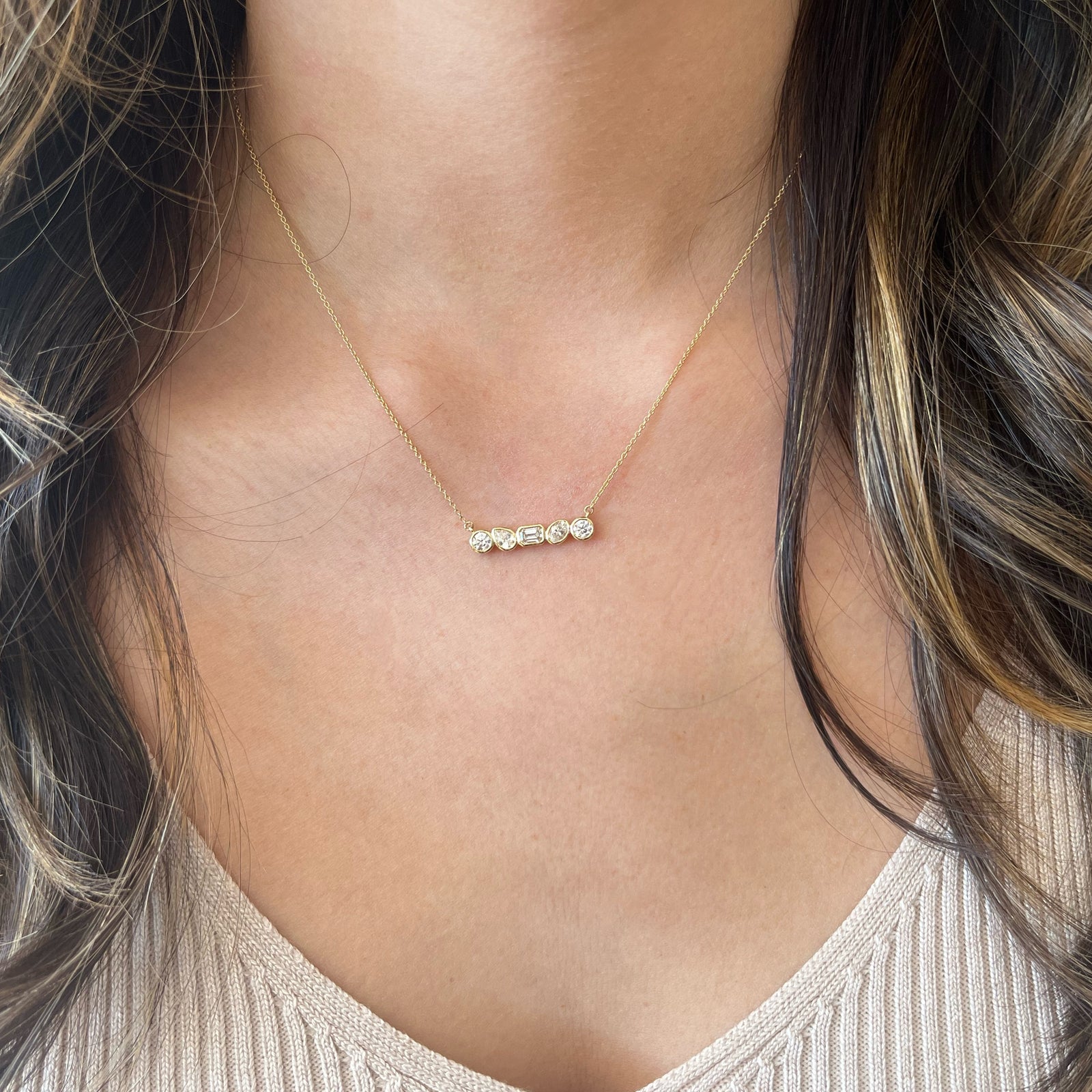 Bezel-Set Mixed Shape Diamond Bar Pendant Necklace - 14K gold weighing 2.48 grams - 2 round brilliant-cut diamonds weighing 0.29 carats - 0.16 ct oval-shaped diamond - 0.14 ct pear-shaped diamond - 0.20 ct emerald-cut diamond