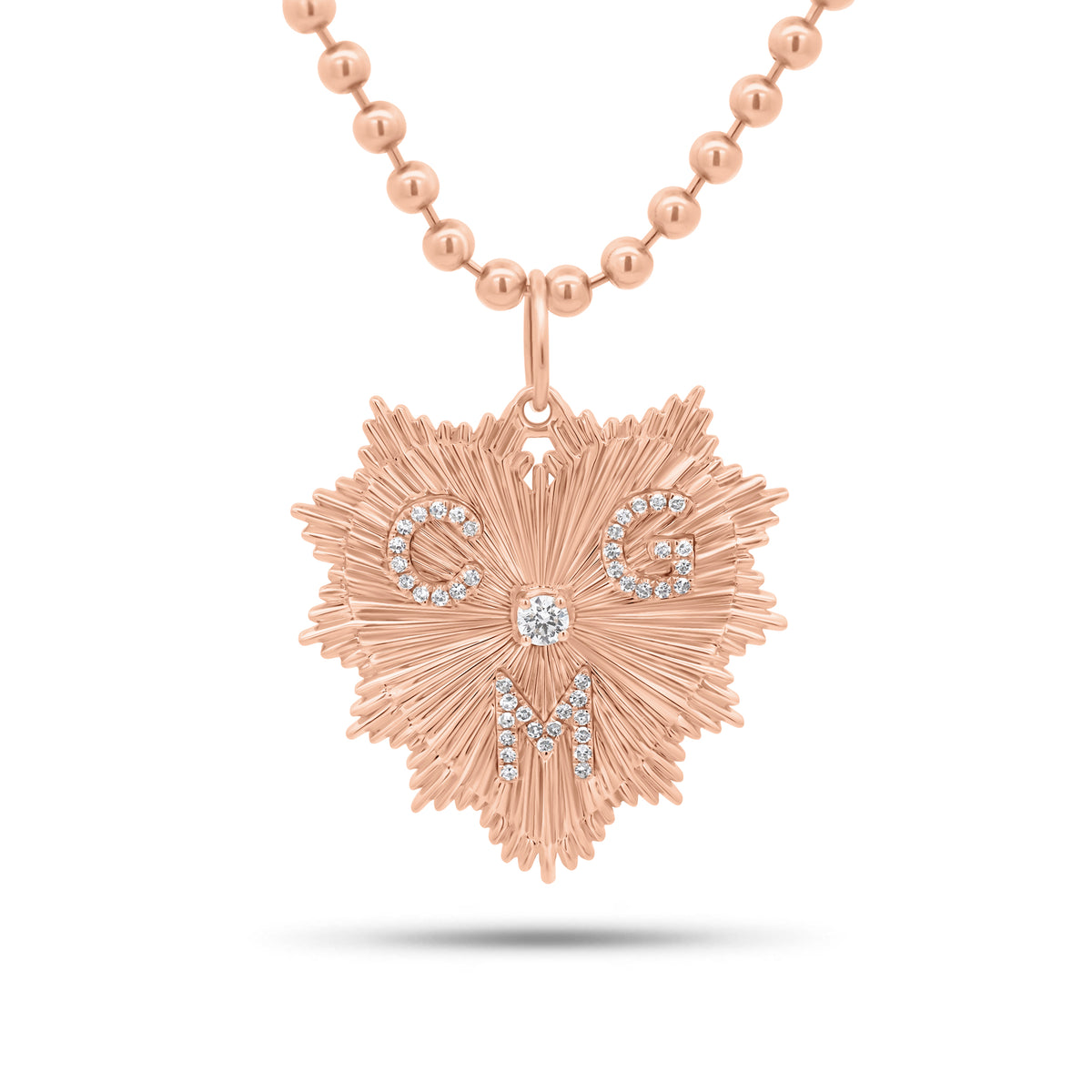 Fluted Gold Heart Pendant with Diamond Initials - 14K gold weighing 4.12 grams
- 44 round diamonds weighing 0.19 carats