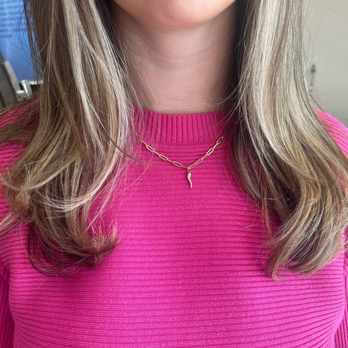 Female Model Wearing Pave Diamond Italian Horn Pendant - 14K gold weighing 0.47 grams - 106 round diamonds weighing 0.27 carats