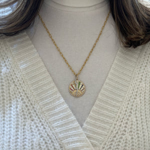 Female Model Wearing Diamond & Multicolor Sapphire Lucky Symbols Pendant - 14K gold weighing 8.20 grams - 95 round diamonds weighing 0.44 carats - 52 fancy-color sapphires weighing 0.38 carats