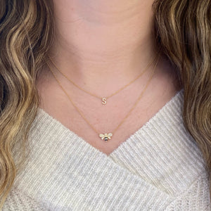 Female model wearing - 1Diamond bee pendant necklace - 14K gold weighing 1.95 grams - 49 round diamonds weighing 0.13 carats