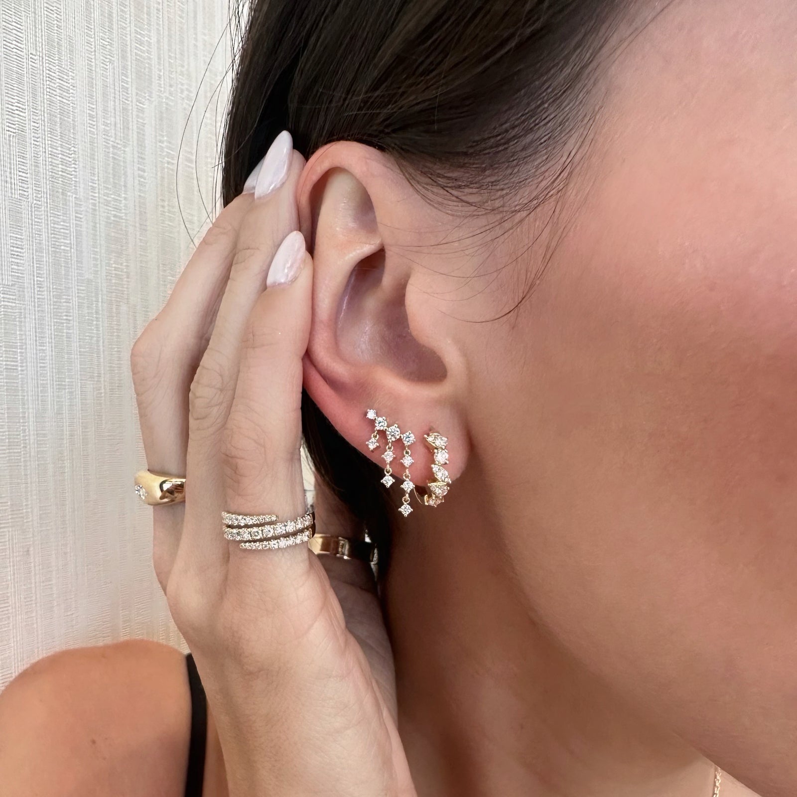 Round Diamond Mixed Shapes Huggie Earrings - 14K gold weighing 2.33 grams  - 16 round diamonds weighing 0.39 carats  - 2 pear-shaped diamonds weighing 0.10 carats