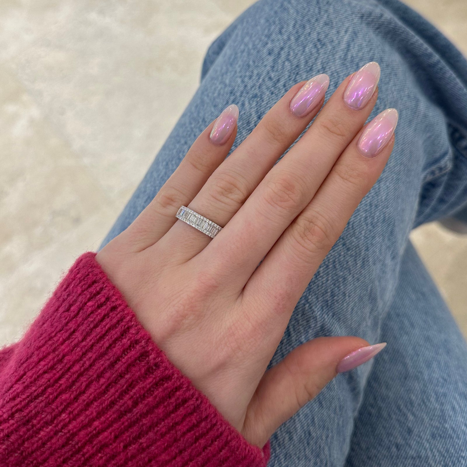 Baguette Diamond Wedding Band  - 18K gold weighing 5.41 grams  - 22 straight baguettes totaling 0.82 carats  - 54 round diamonds totaling 0.24 carats