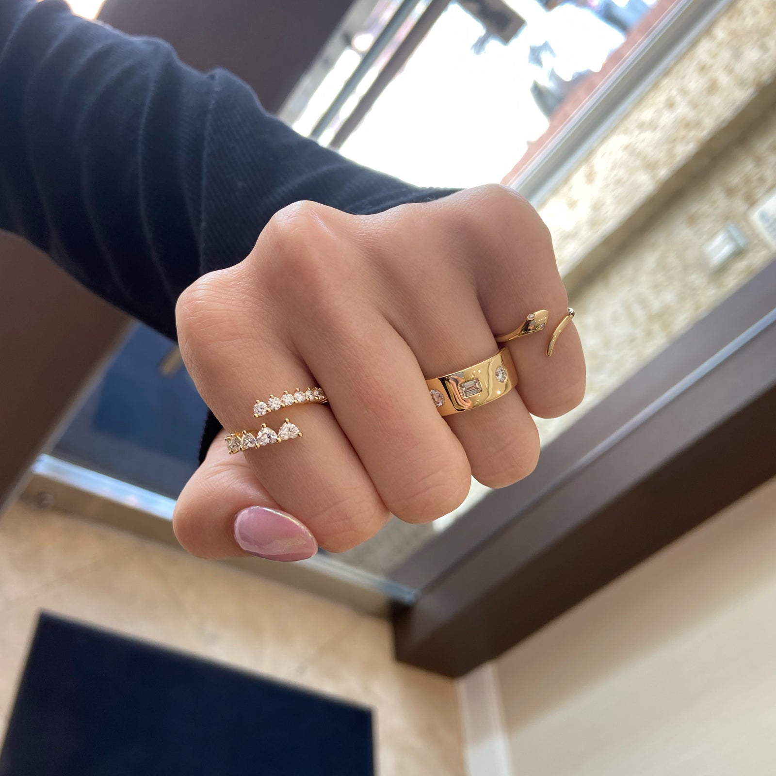 Diamond Snake Ring - 14K gold weighing 1.72 grams  - 2 round diamonds weighing 0.02 carats