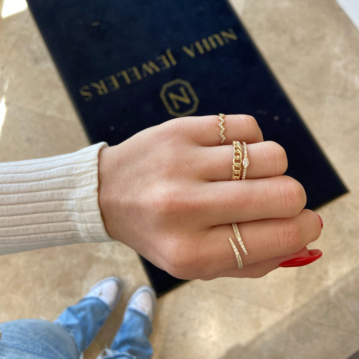 Female Model Wearing Marquise Diamond Petite Ring - 14K gold weighing 1.21 grams - 0.13 ct marquise-shaped diamond - 20 round diamonds weighing 0.14 carats